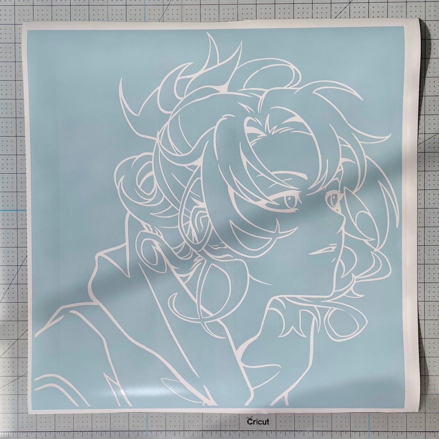 Vinyl decal with an outline of a stylized anime character's face and hair on a blue background.